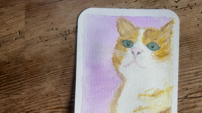 Auf dem Bild sieht man eine von Hand gemalte Katze als Symbol für die Trauer um ein Tier und die Magie der emotionalen Nähe